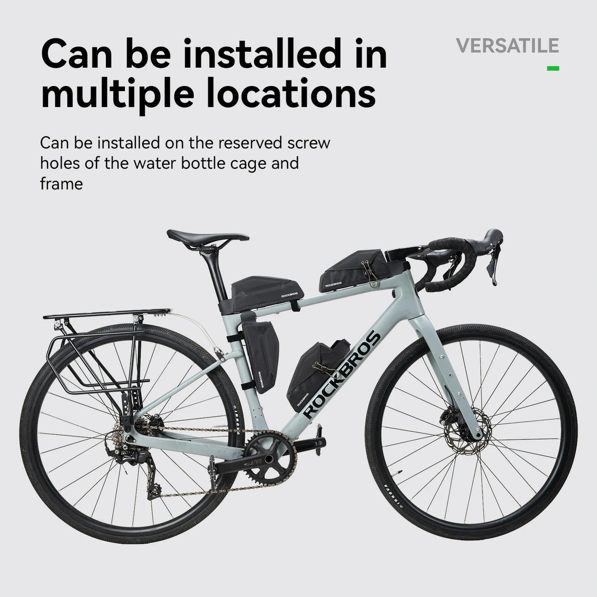 A light gray Rockros road bicycle shown on a pale gray background with marketing text stating it can be installed in multiple locations on the bottle cage and frame.