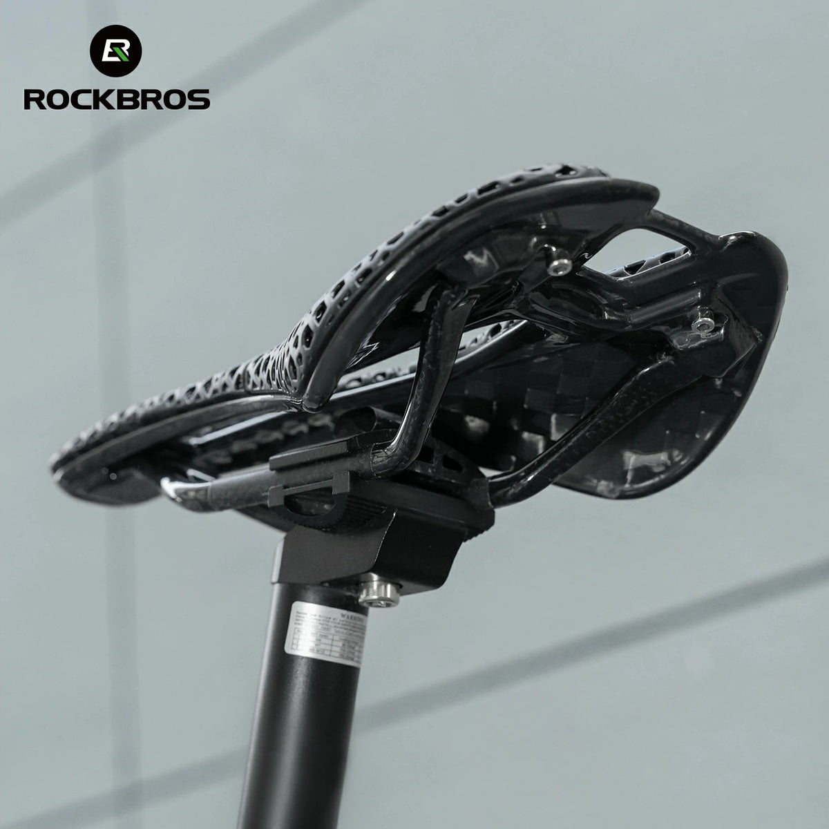 Close-up of a bicycle seat with 'RockBros' branding on a gray background