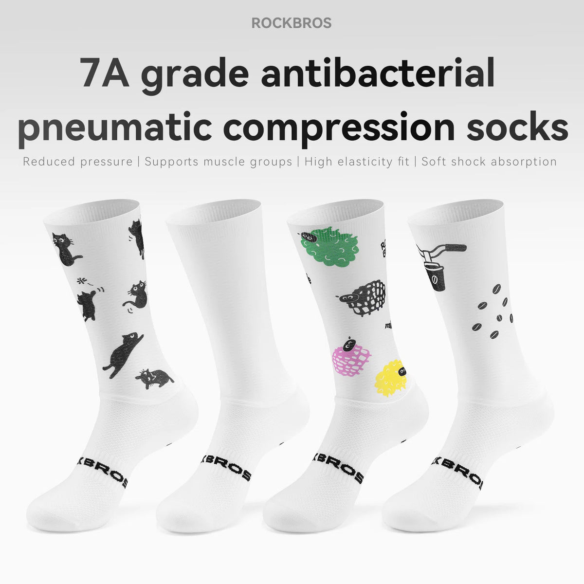 Four white ROCKBROS compression socks displayed against a light gray background with promotional text. The socks feature various printed designs including black cat silhouettes, a green tree, a black-and-white patterned fish, and black coffee beans, with the ROCKBROS brand name printed near the foot.