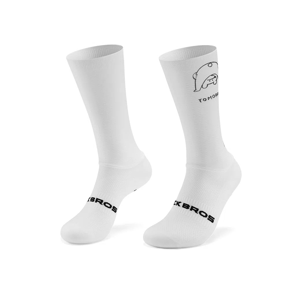 A pair of white crew-length athletic socks with black printed branding and a small line-art graphic on the upper leg, shown on a clean white background. #Color_Bear