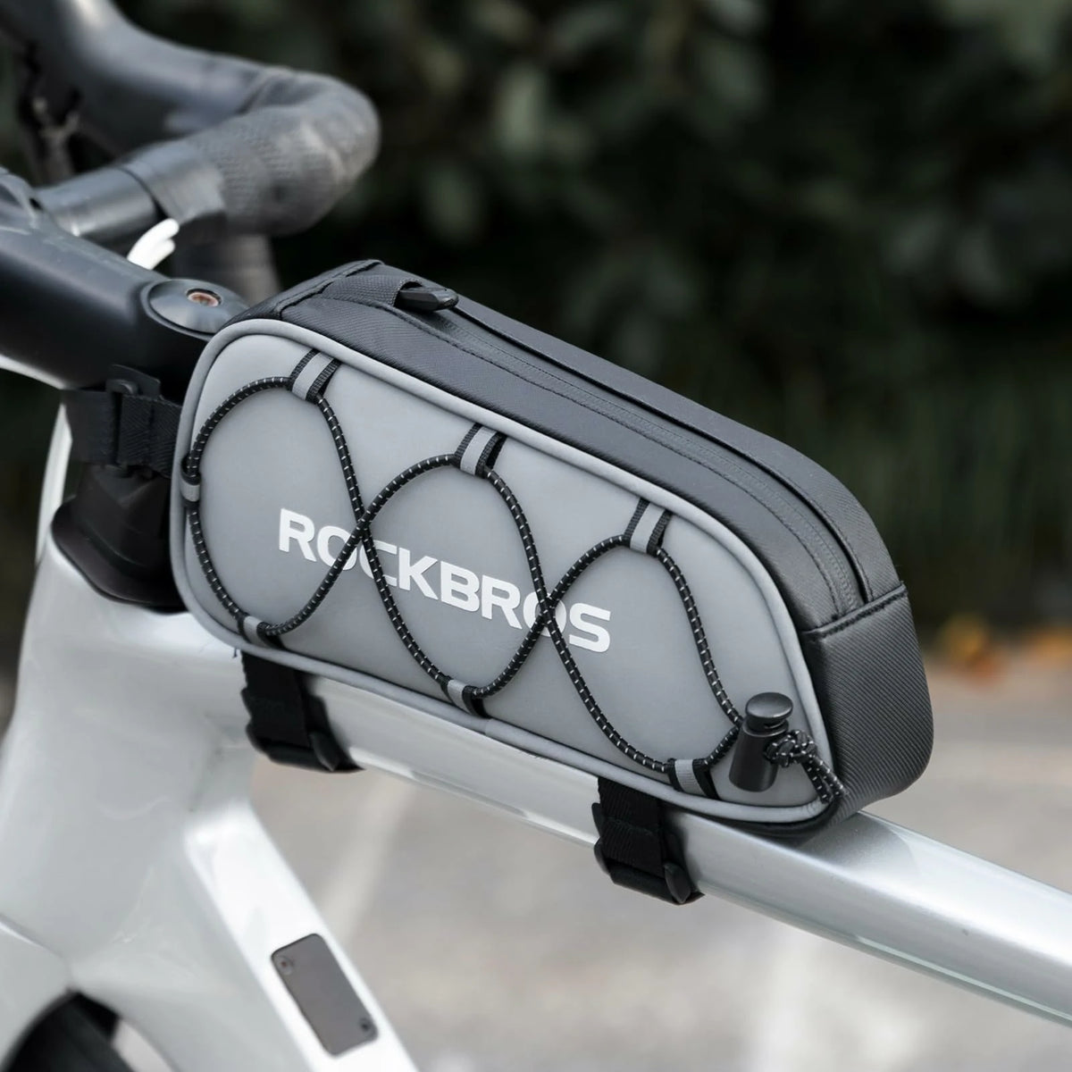 Bicycle frame bag with 'ROCKBROS' branding attached to a bike handlebar. #color_silver