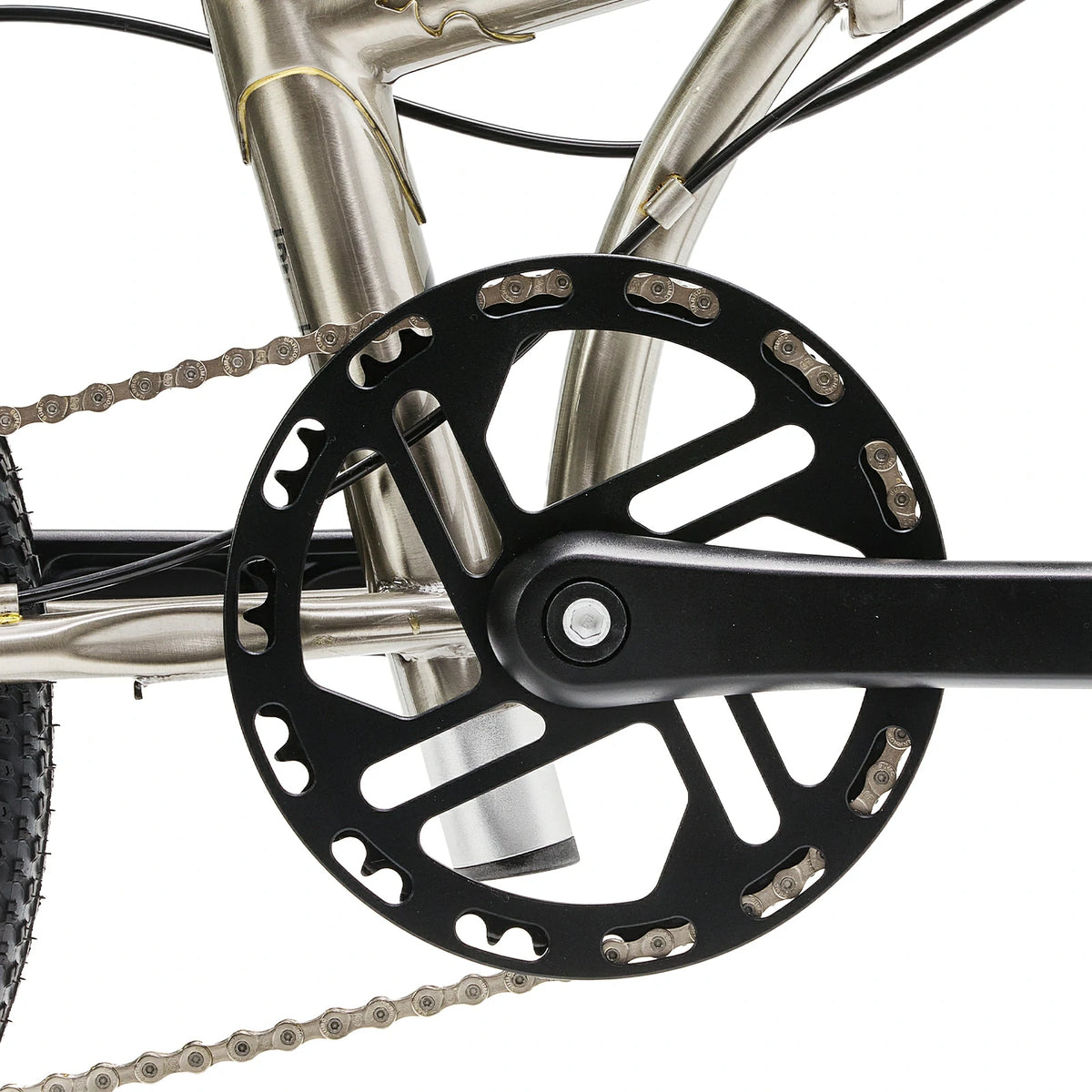 Close-up of a bicycle chainring and chain on a white background