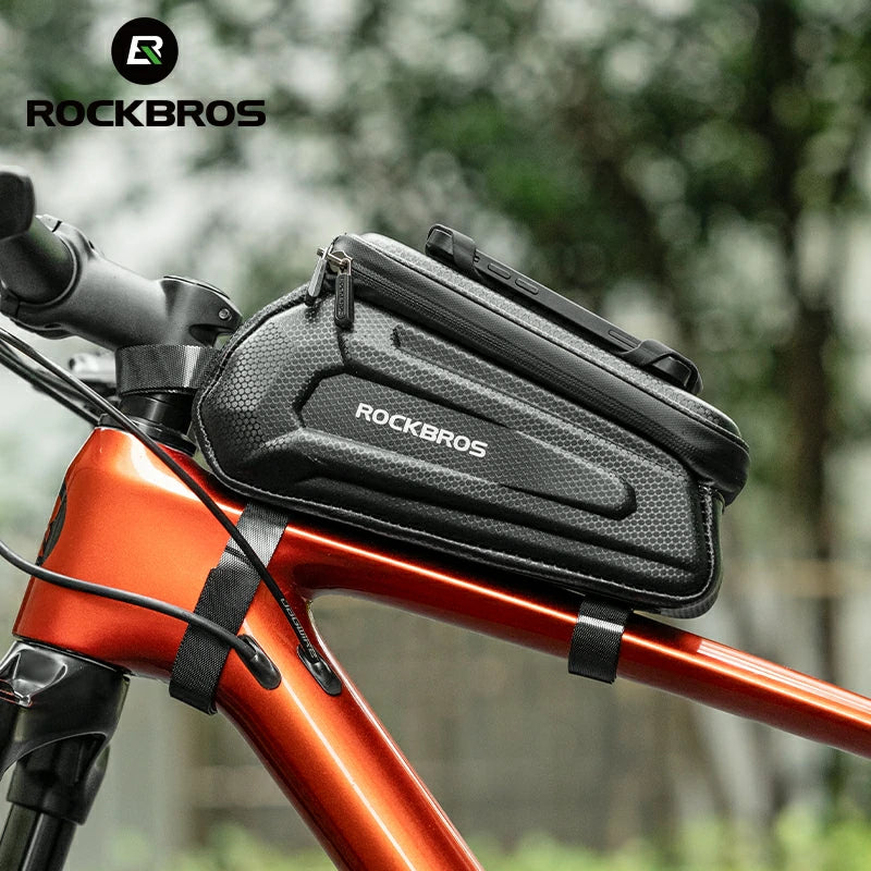 Bicycle handlebar bag with ROCKBROS branding against a blurred natural background