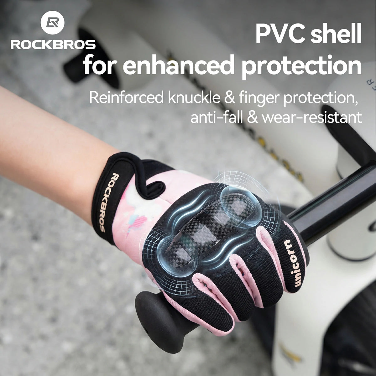 Pink and black glove with 'RockBros' branding on a blurred background