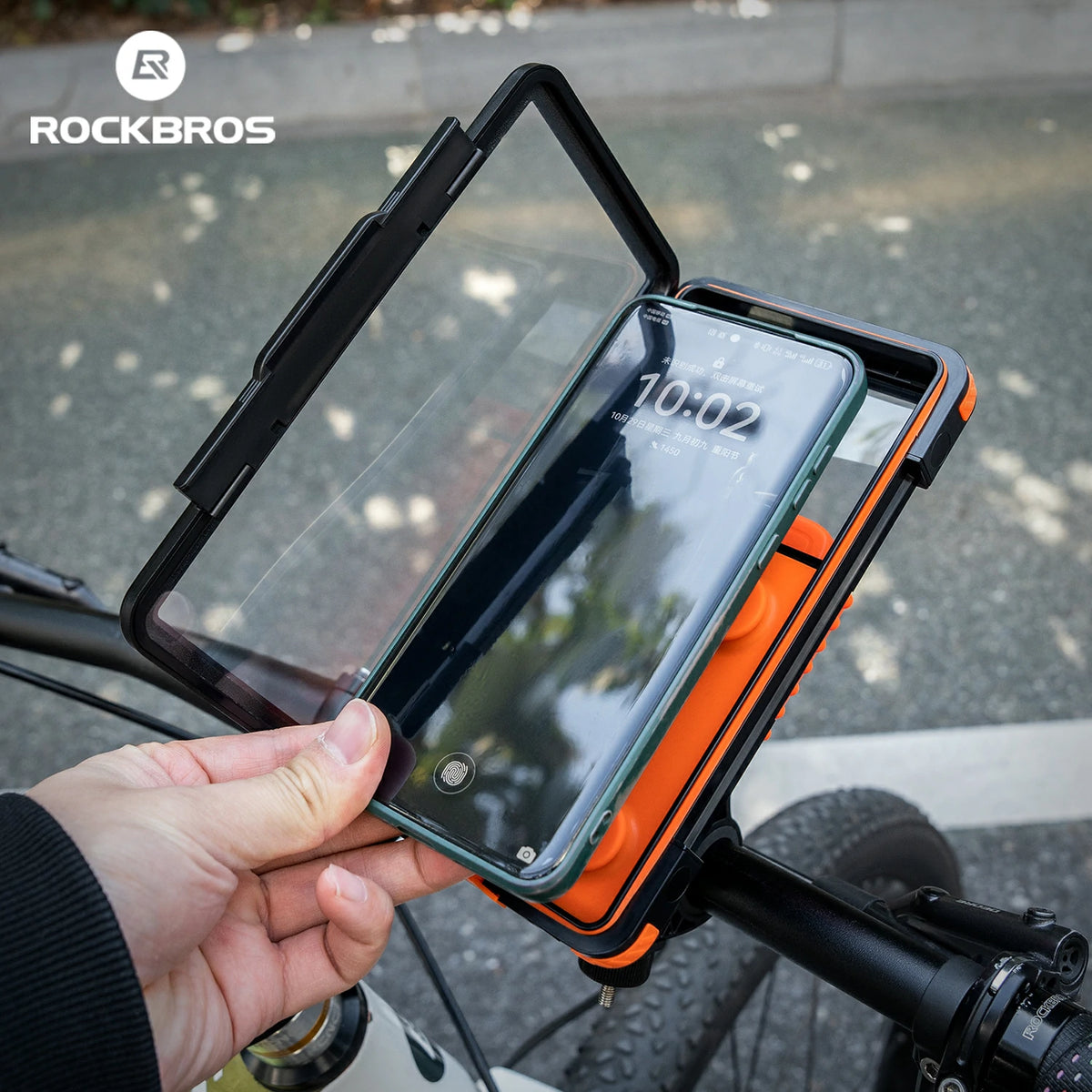 Phone mount on a bicycle handlebar with RockBros branding