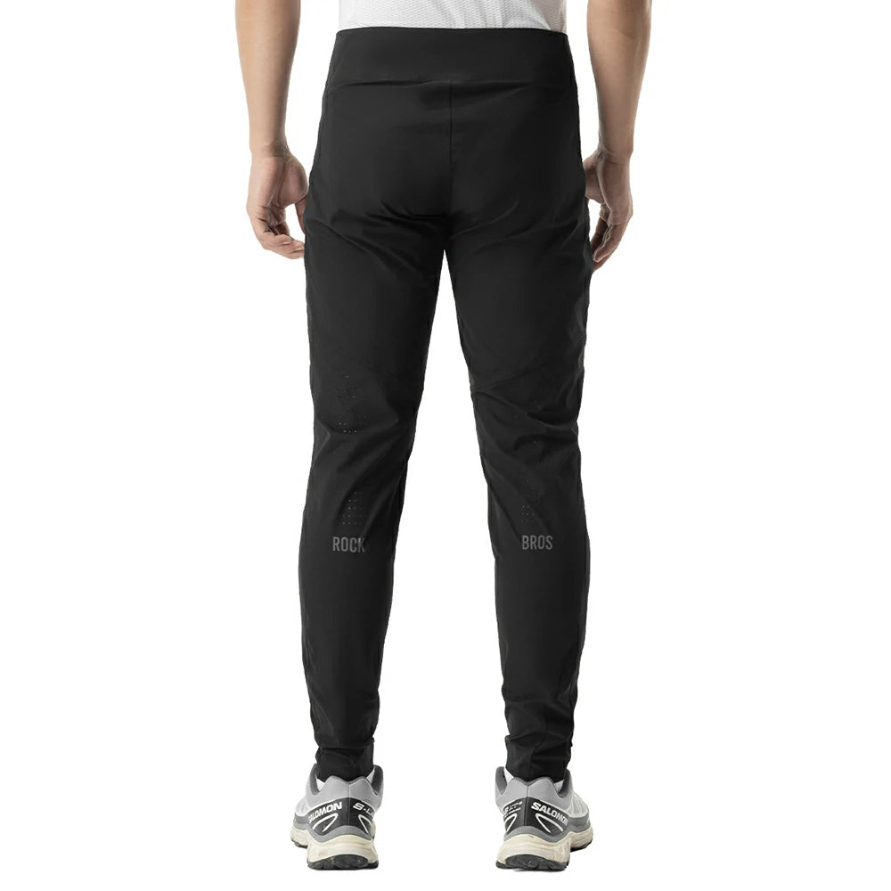 Black athletic pants shown from the back on a model, featuring subtle gray 'ROCKBROS' branding on the lower legs, against a plain white background.