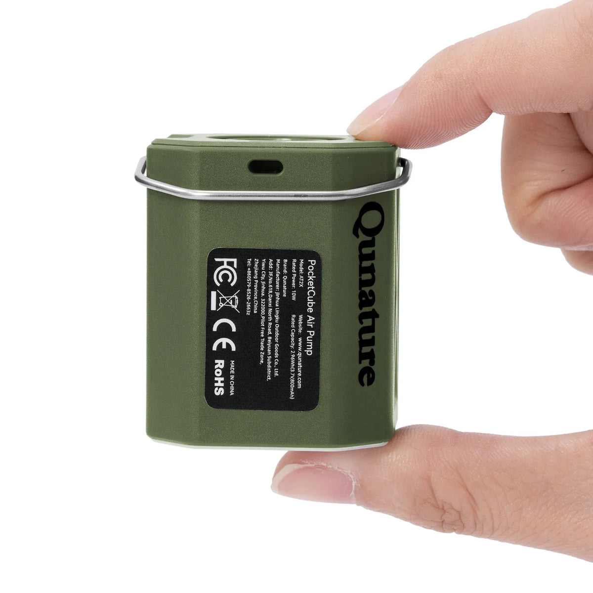 Green portable air pump with 'Qunature' branding held by a hand on a white background