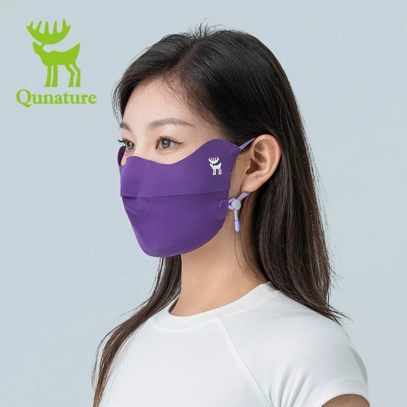 Person wearing a purple face mask with Qunature logo on a light gray background