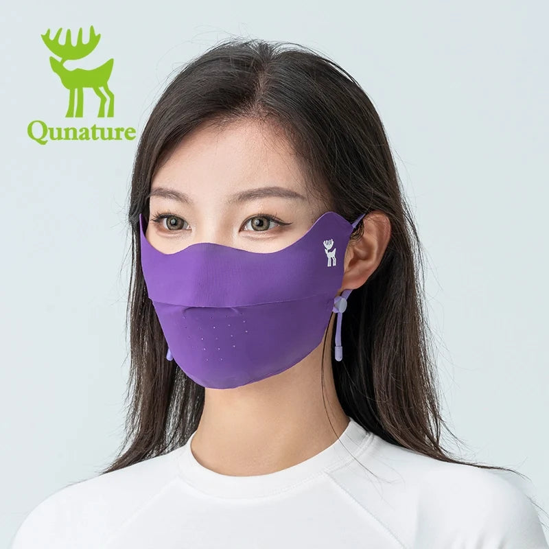 Woman wearing a face mask with Qunature branding on a gray background