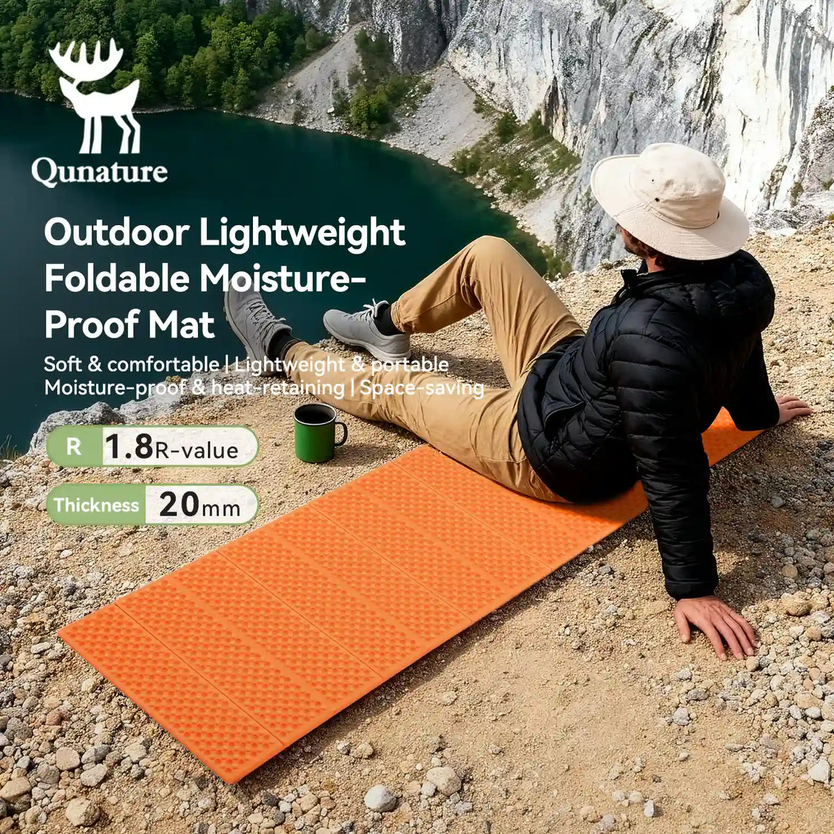 Person sitting on an orange Qunature outdoor mat with a scenic background
