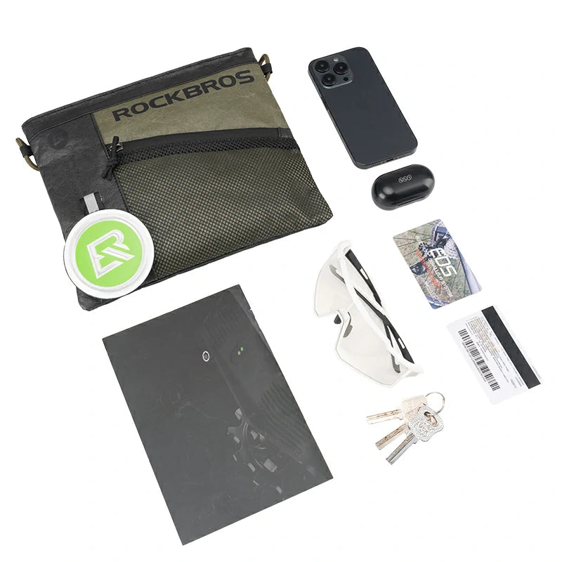 Collection of items including a green 'RockBros' bag, phone, wallet, keys, and cards on a white background.