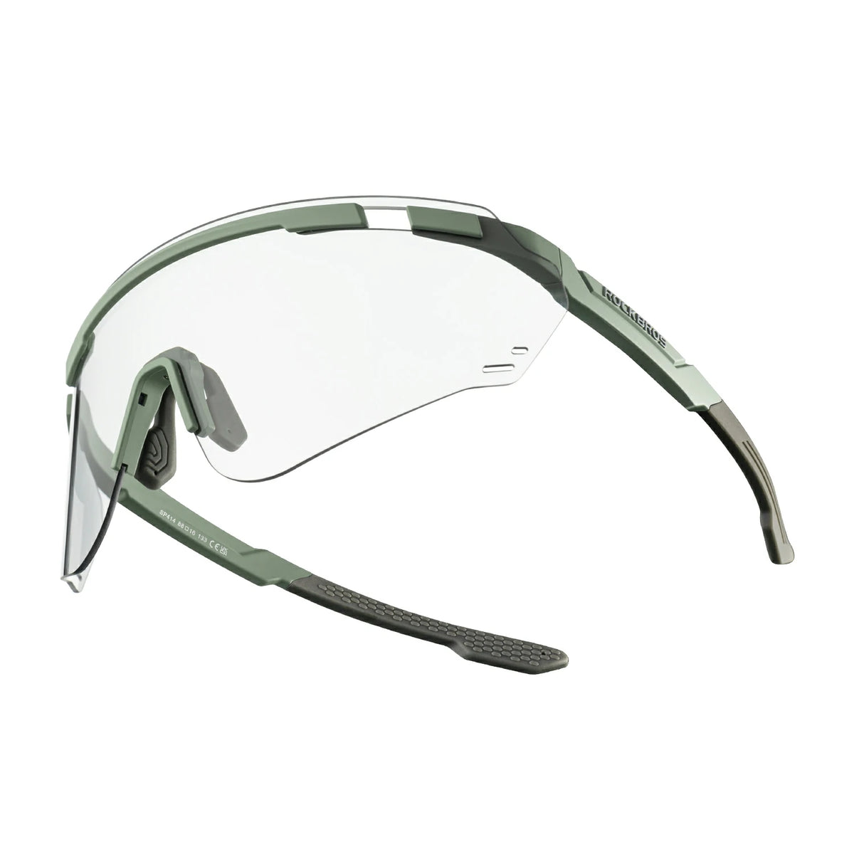 Safety glasses with a matte olive green frame and a clear shield lens, shown from a side profile on a white background. #Color_Gray