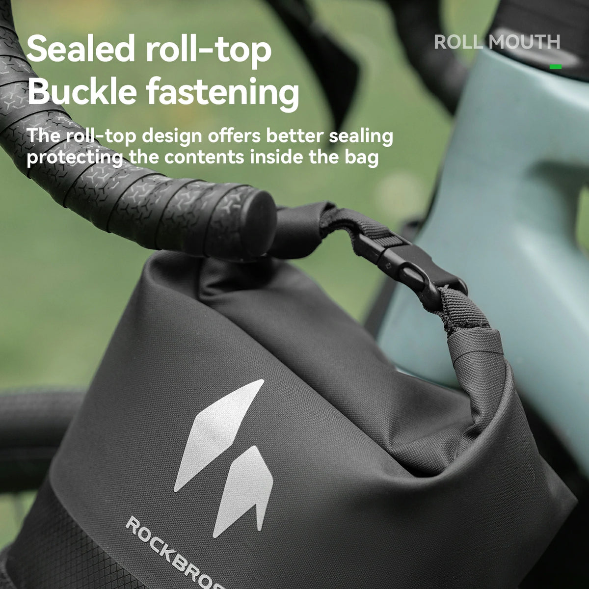 Roll-top bike bag with buckle fastening on fork rack.
