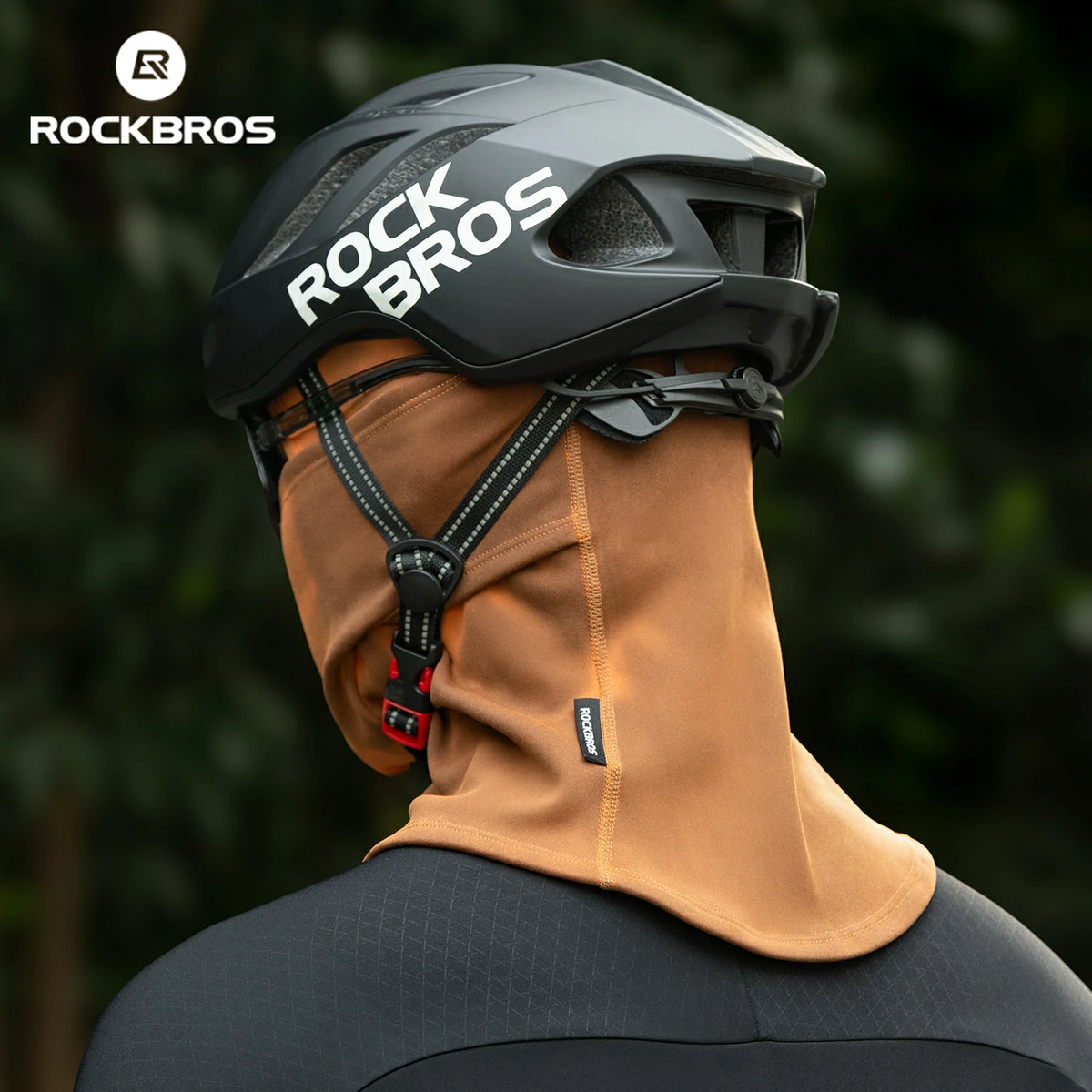 Person wearing a black 'Rock Bros' helmet and brown balaclava with blurred green background #color_Brown