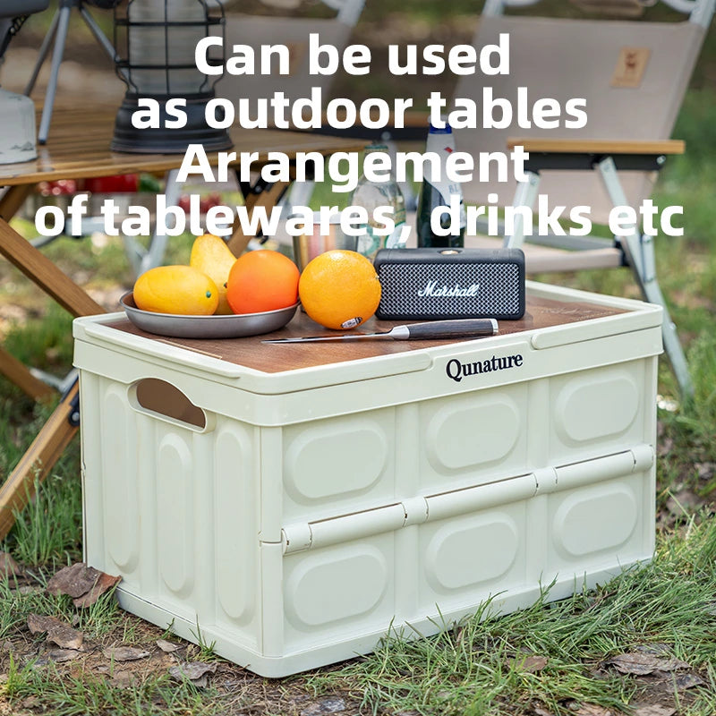 Storage box with a wooden top used as an outdoor table, surrounded by nature.