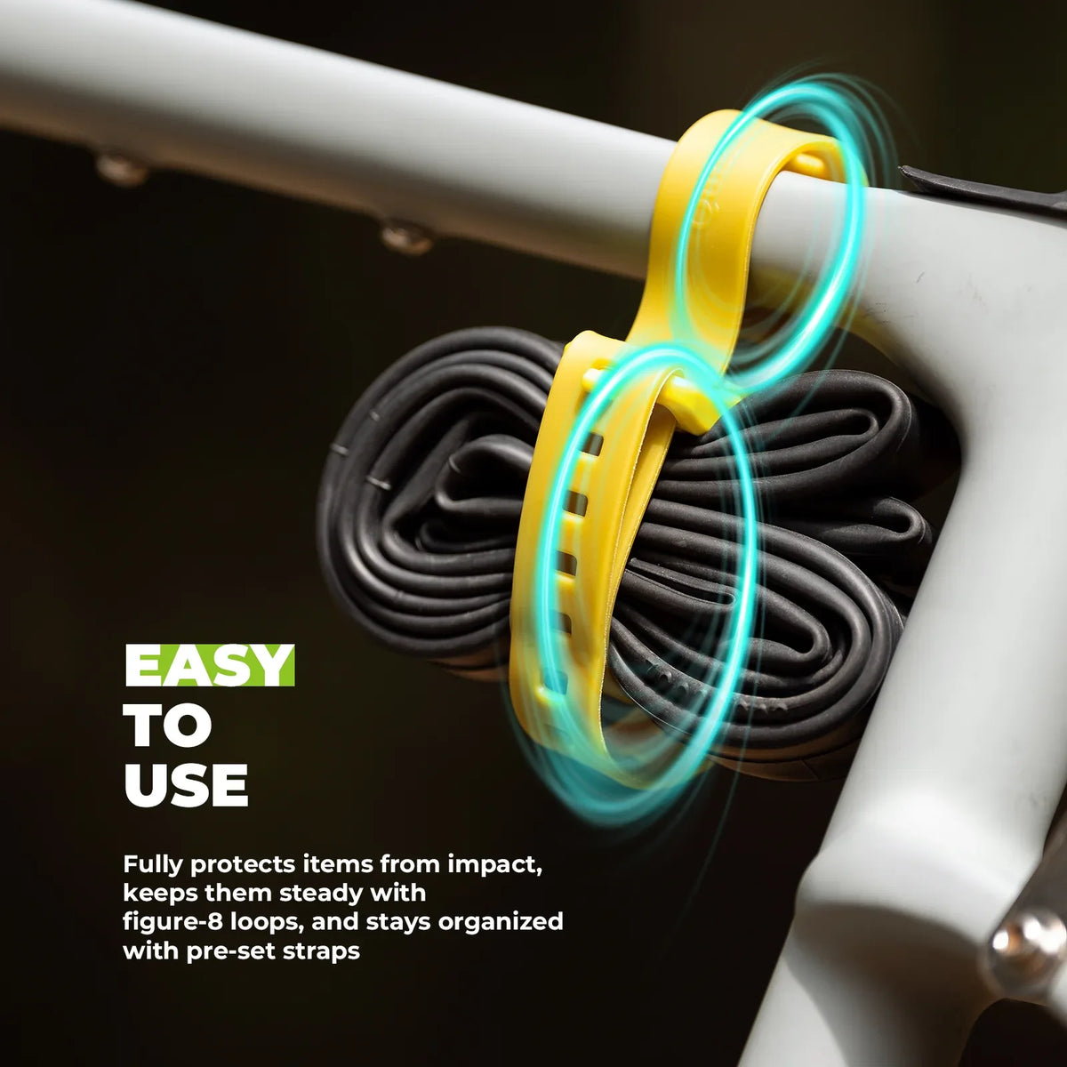Yellow and green strap on a bike frame with text about its ease of use.