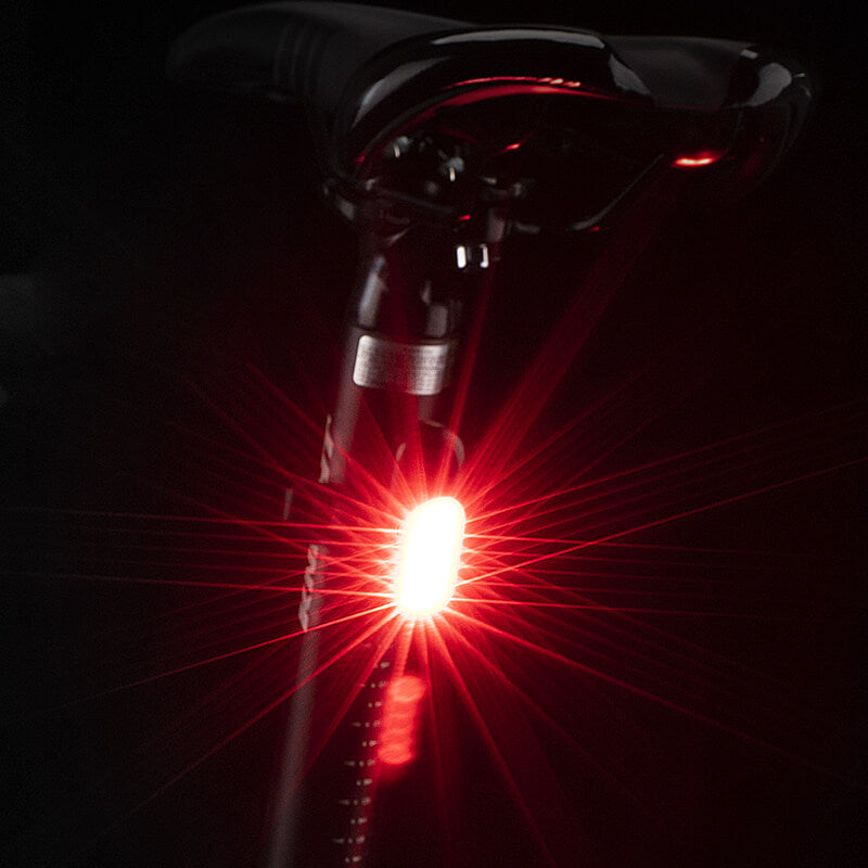 Compact ROCKBROS COB mini rear light, offering bright visibility and enhanced safety for night cycling.