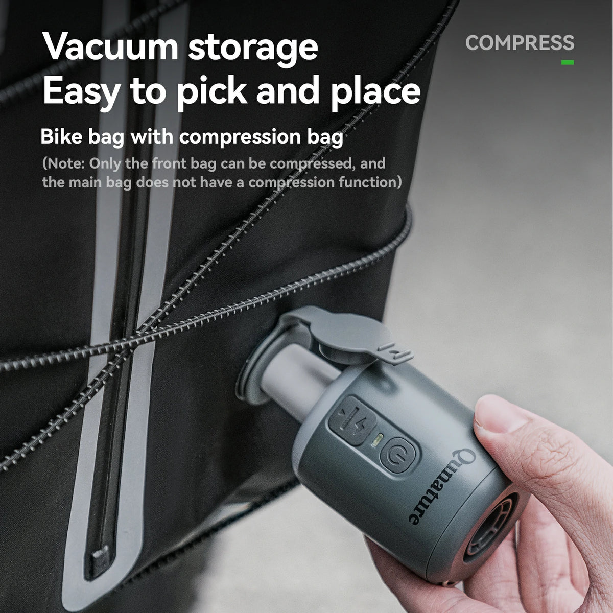 Hand holding a vacuum compression device next to a bike bag with text about vacuum storage.
