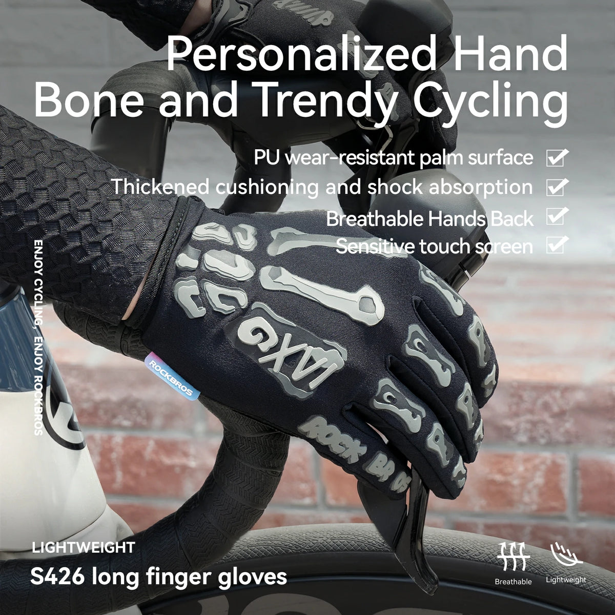 A close-up of a black cycling glove with white skeletal bone graphics on the back of the hand, worn on a hand gripping a bicycle handlebar. The image features promotional text overlays highlighting features like 'Personalized Hand Bone and Trendy Cycling' and 'S426 long finger gloves'.