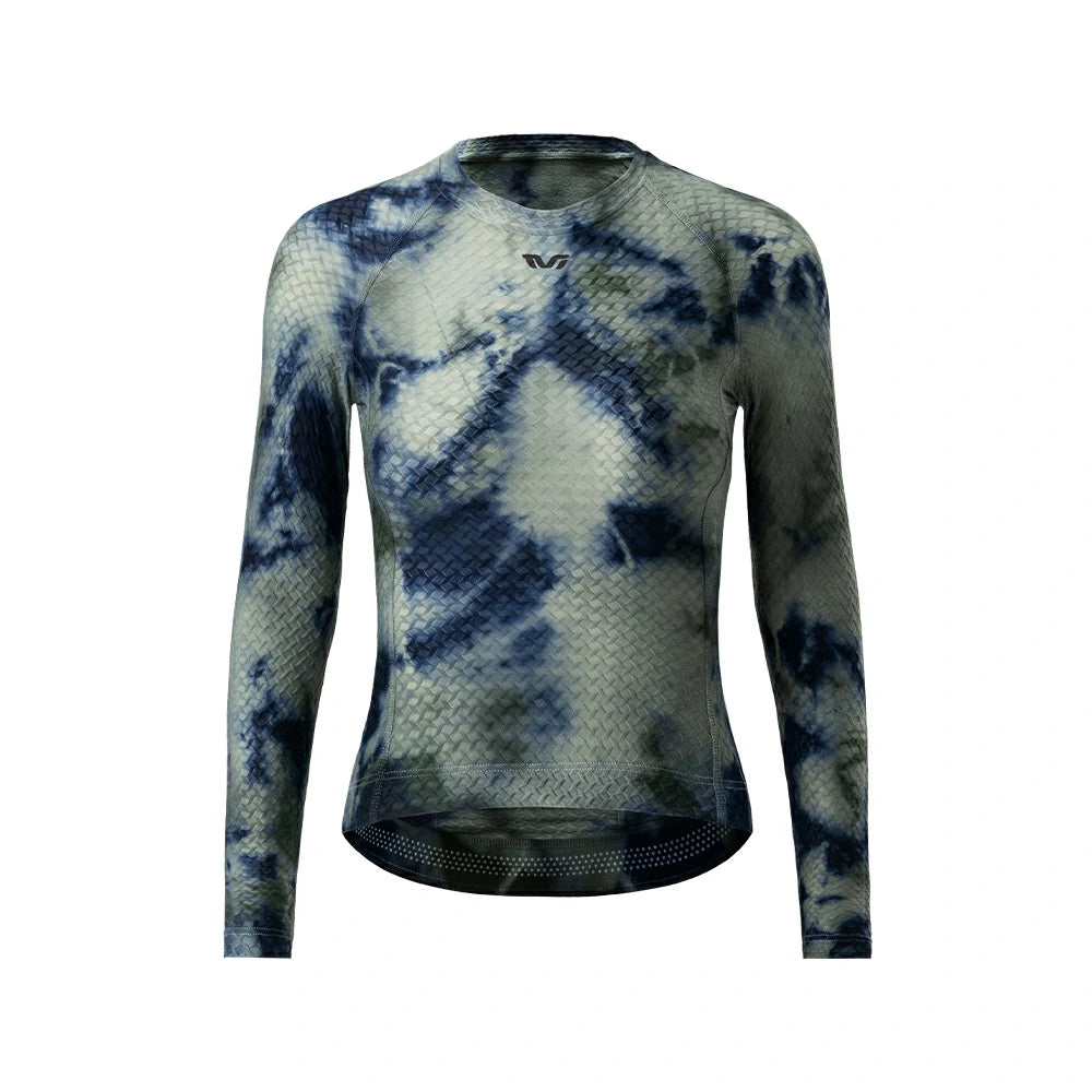 A long-sleeve athletic compression top with a blue and gray tie-dye pattern, featuring a textured mesh fabric and a small black logo on the chest, displayed on a solid white background.  #Color_Gray